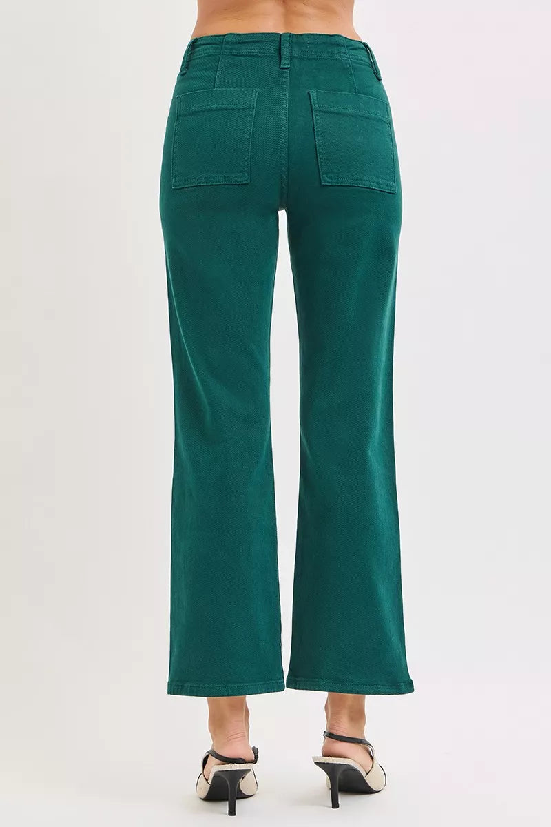 Hunter green high-rise ankle flare jeans from back view, patch pockets