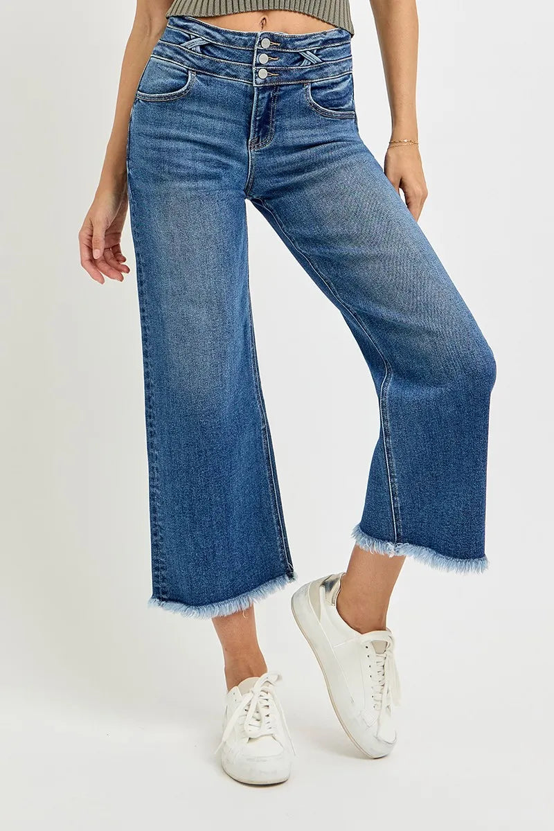 Side view: dark high-rise crop wide-leg jeans with wide waistband band detail