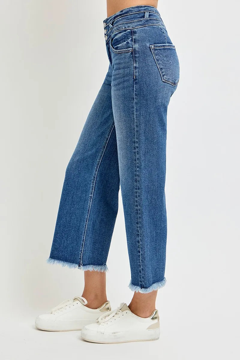 Back view of dark wash high-rise crop wide-leg jeans with frayed hem
