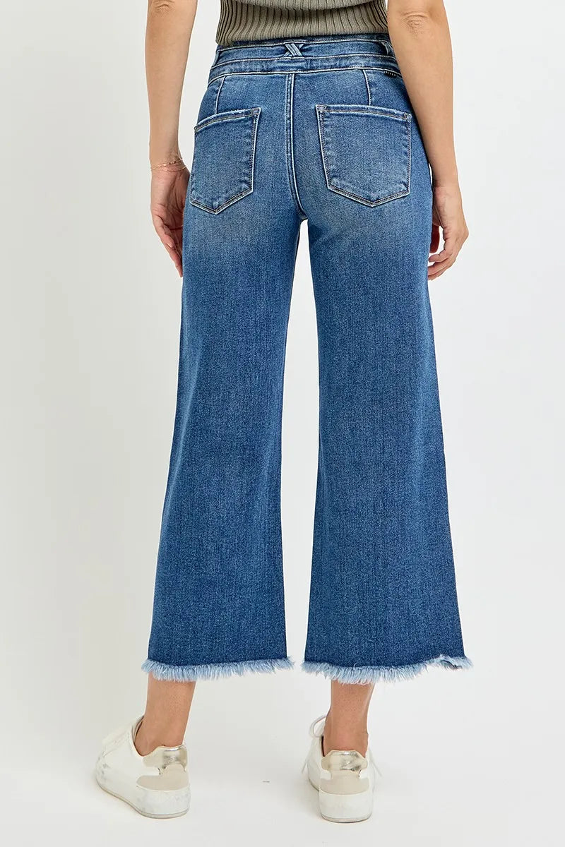 Dark high-rise crop wide-leg jeans back: two patch pockets, belt loops, frayed hem