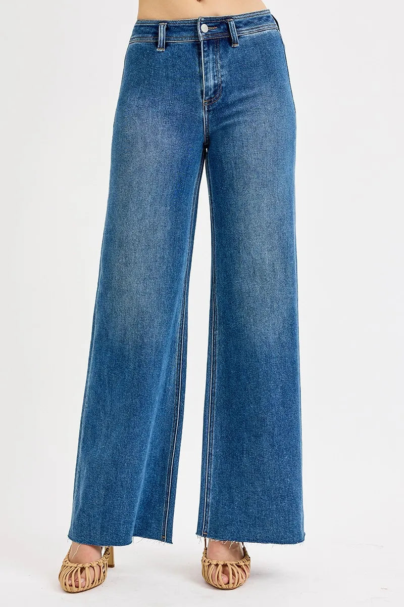 Medium-wash high-waisted wide-leg jeans with button fly and front pockets