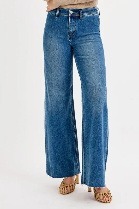 Back view of medium-wash high-waisted wide-leg jeans with belt loops and rear pockets