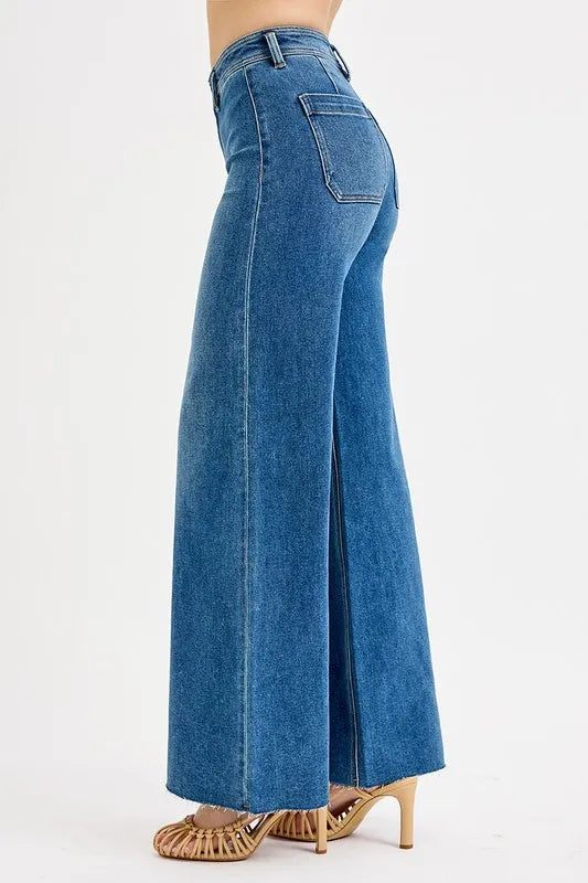 Side profile of medium-wash high-waisted wide-leg jeans with stitched detailing