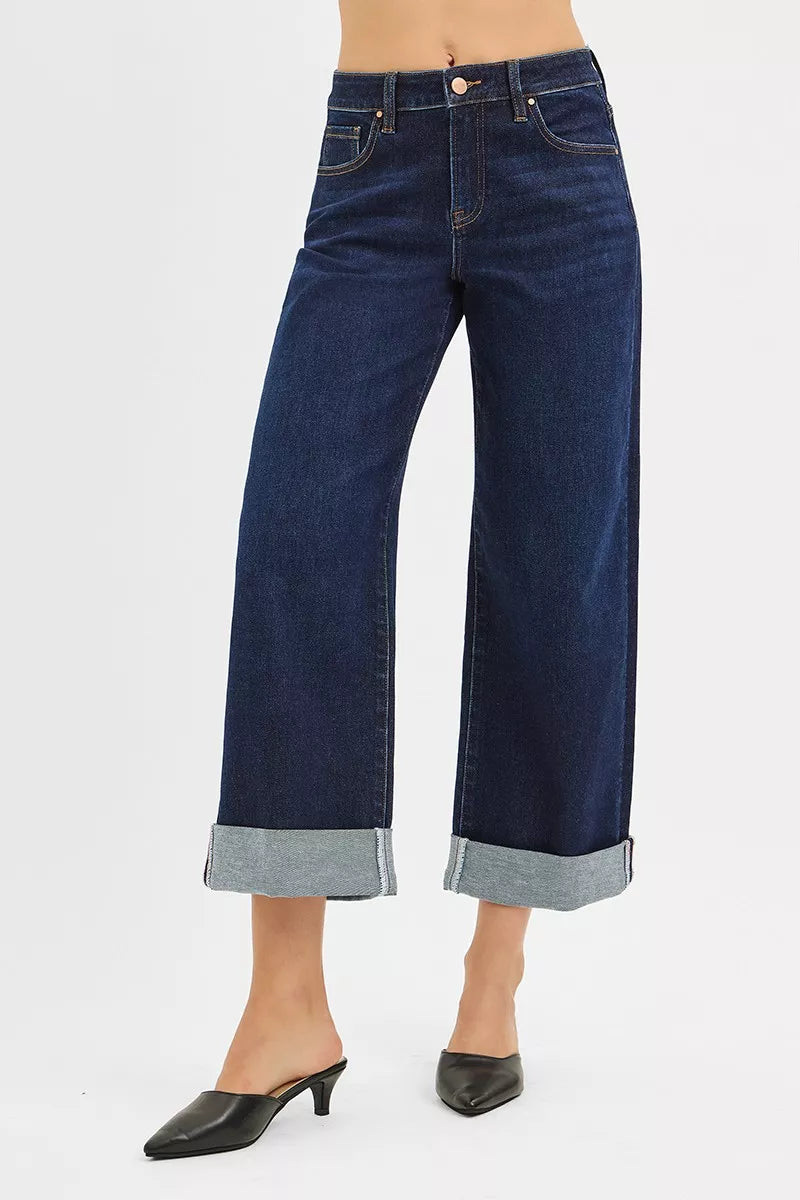 Dark mid-rise wide-leg ankle jeans with rolled hem and button fly