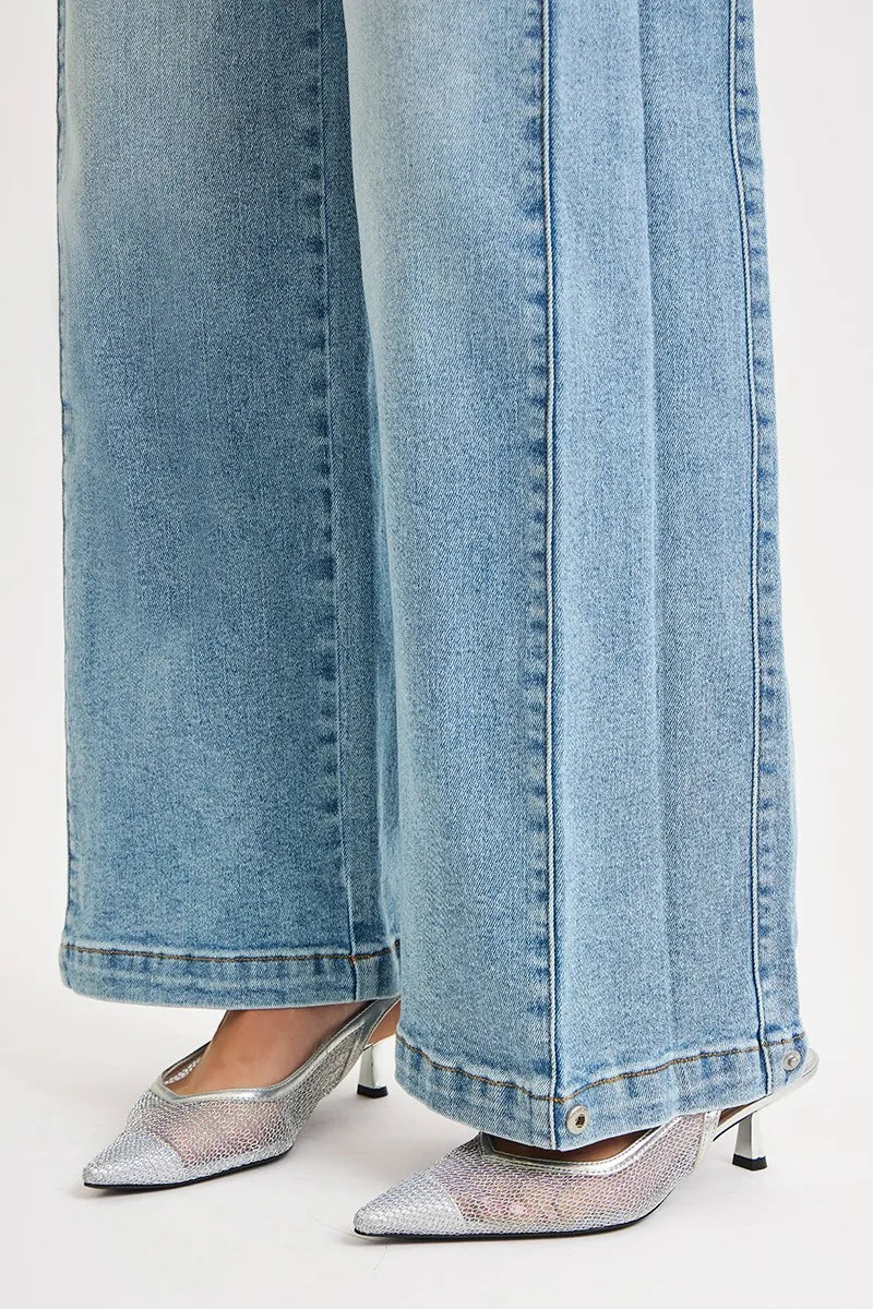 Medium wash wide barrel jeans, mid-rise, snap-button cuffs with split hem
