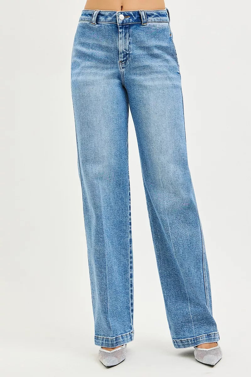 Medium-wash blue slouchy straight jeans with button waistband and belt loops