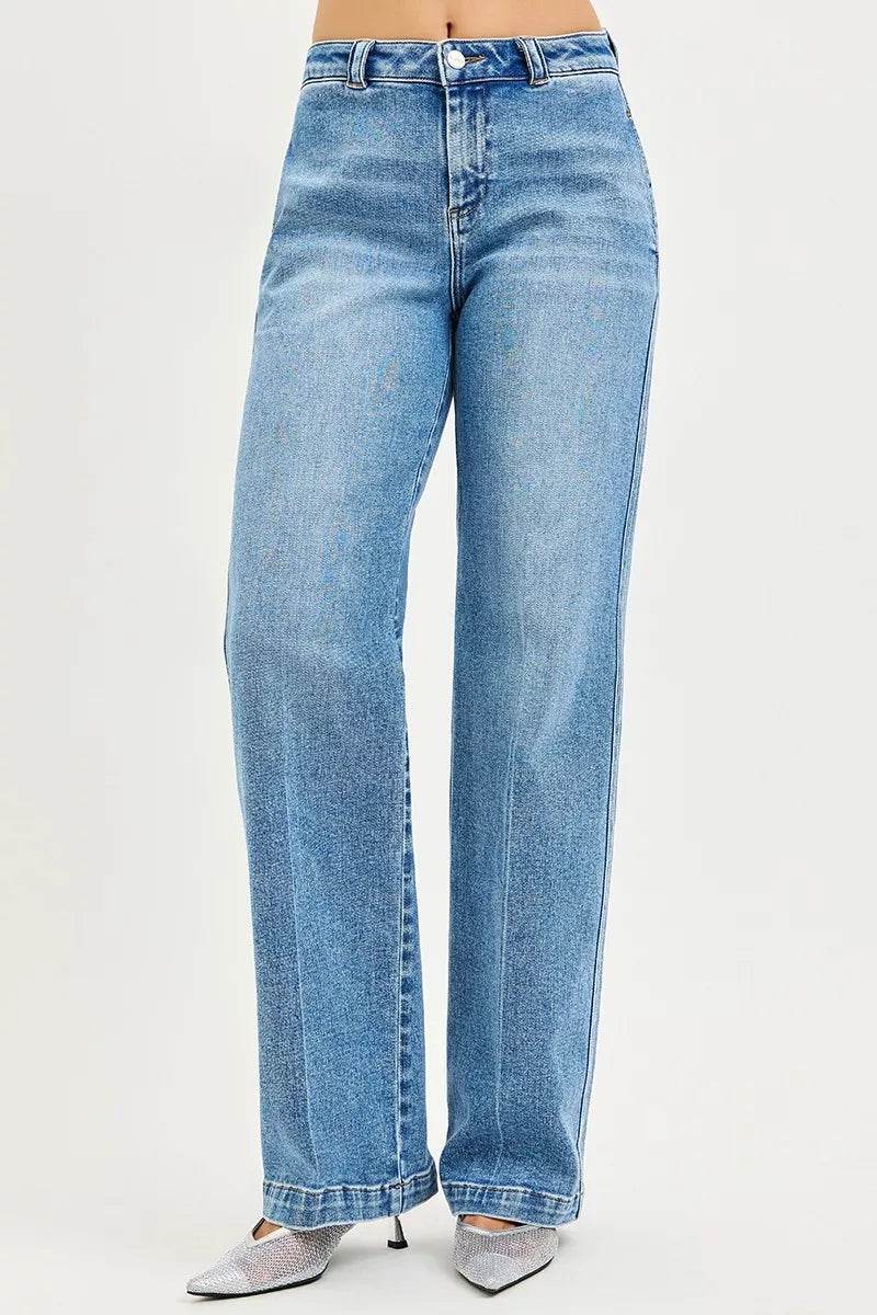 Medium-wash blue slouchy straight jeans with fly, front pockets, and wide leg