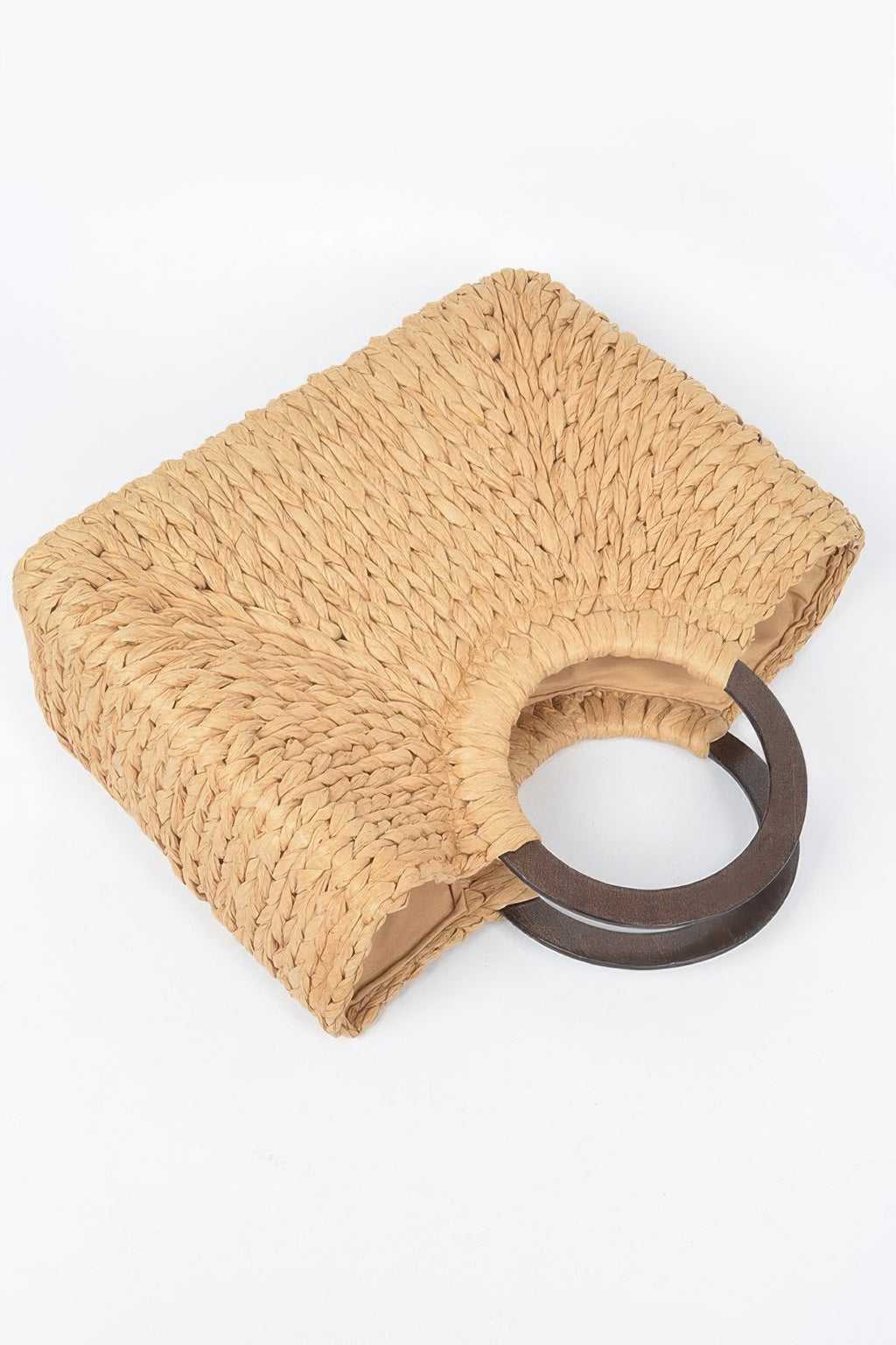 Straw tote bag flat lay with round handle detail