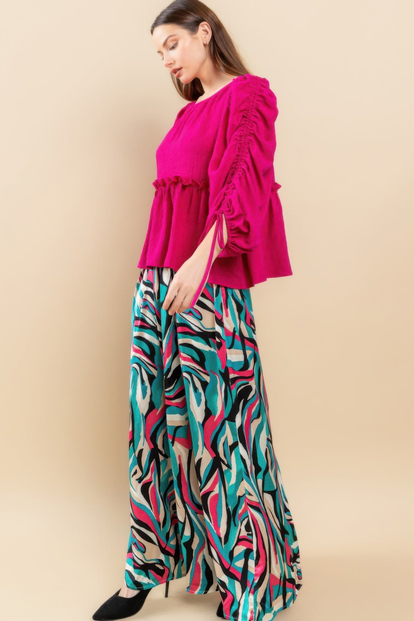 Magenta babydoll top back/side view with gathered waist and sleeve tie details