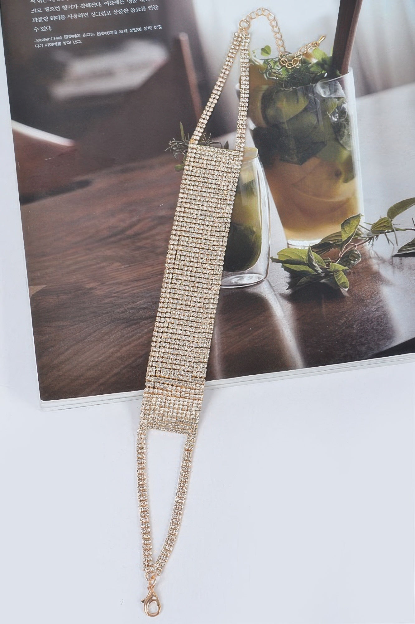 Gold rhinestone choker necklace with long chain extension and lobster clasp