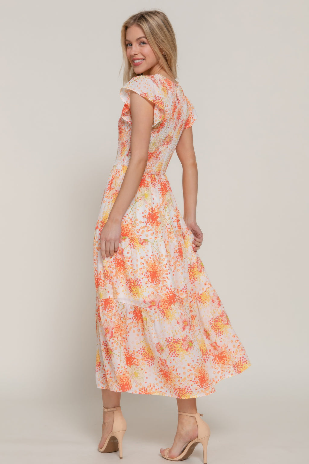 Ruffl Slv smocked floral print dress, side view in ivory/yellow with orange floral spots