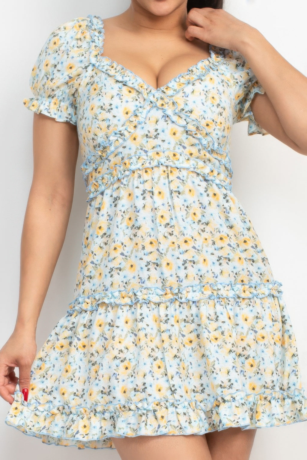 Blue floral puff sleeve dress close-up: ruffled bodice and tiered skirt