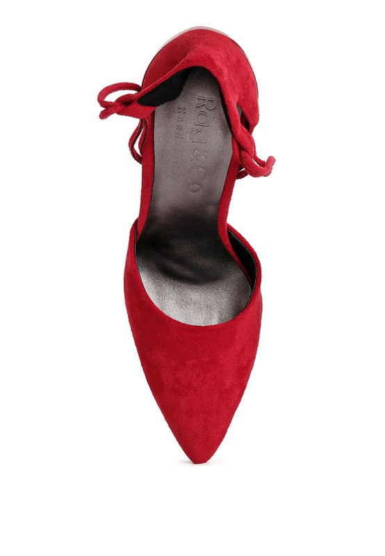 Red lace-up stiletto sandal close-up of pointed toe and ankle laces