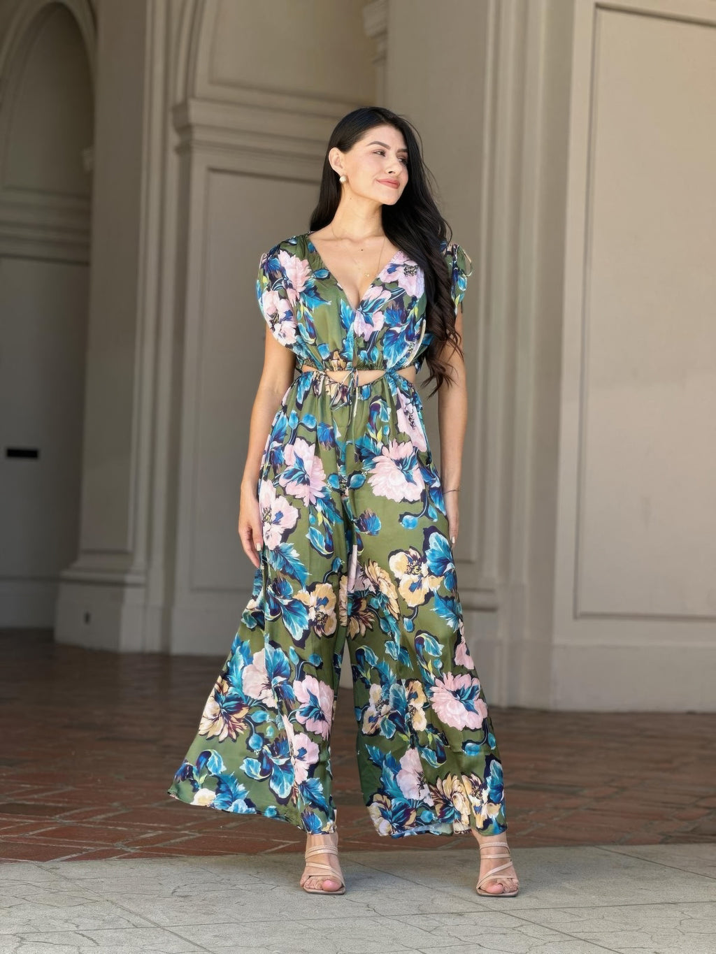 Floral satin jumpsuit with deep V neckline, ruched tie waist and wide straight legs