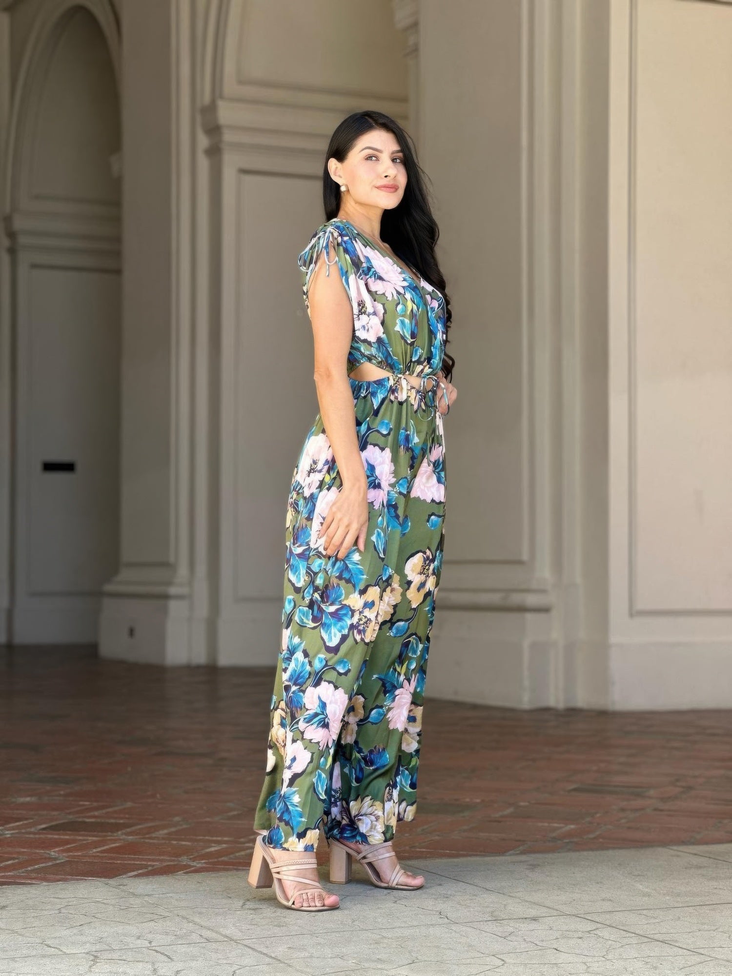 Floral satin maxi jumpsuit with shoulder ties and wide straight legs, side profile