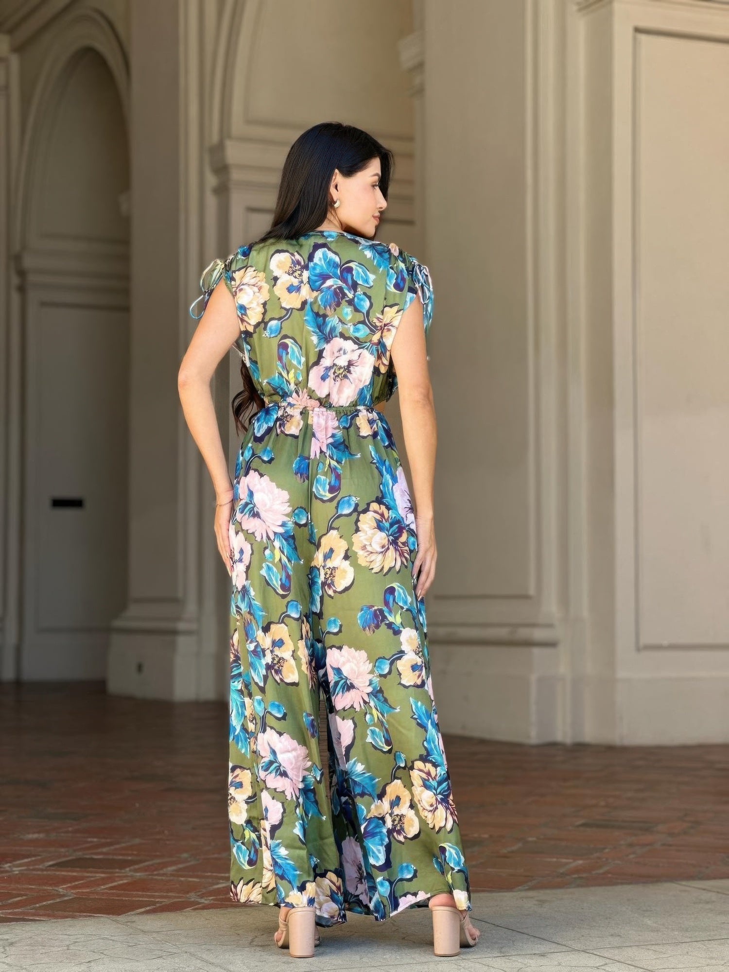 Back view of satin floral jumpsuit with open back, shoulder ties and wide straight legs