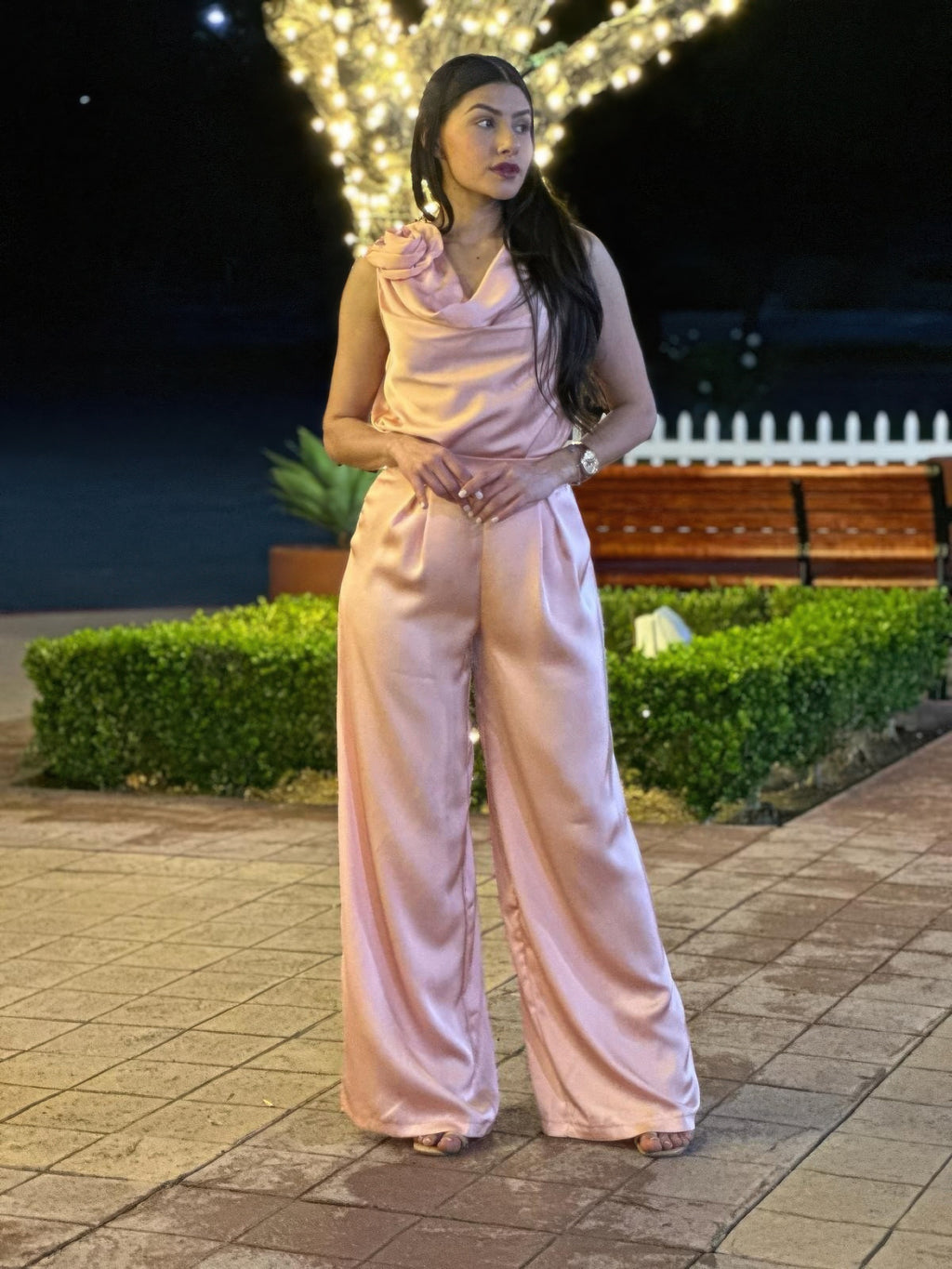 Light pink satin wide-leg pants set with sleeveless cowl-neck top and draped waist