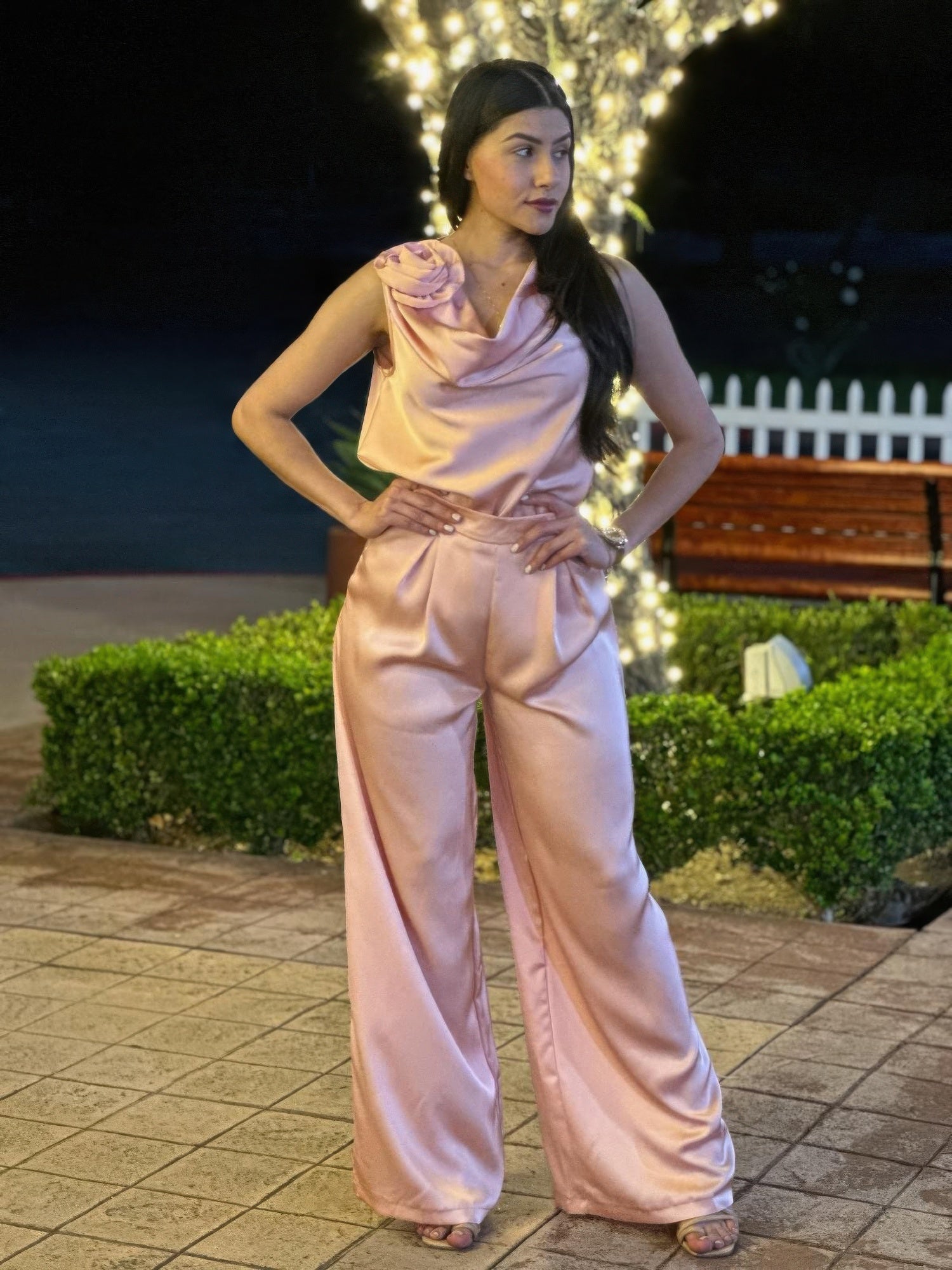 Light pink satin sleeveless top and high-waist wide-leg pants with tied waist detail
