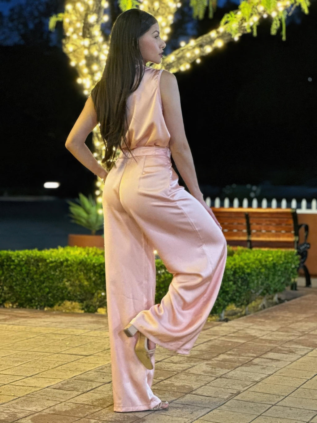 Light pink satin sleeveless top and wide-leg pants with belt-tie waistband, side view