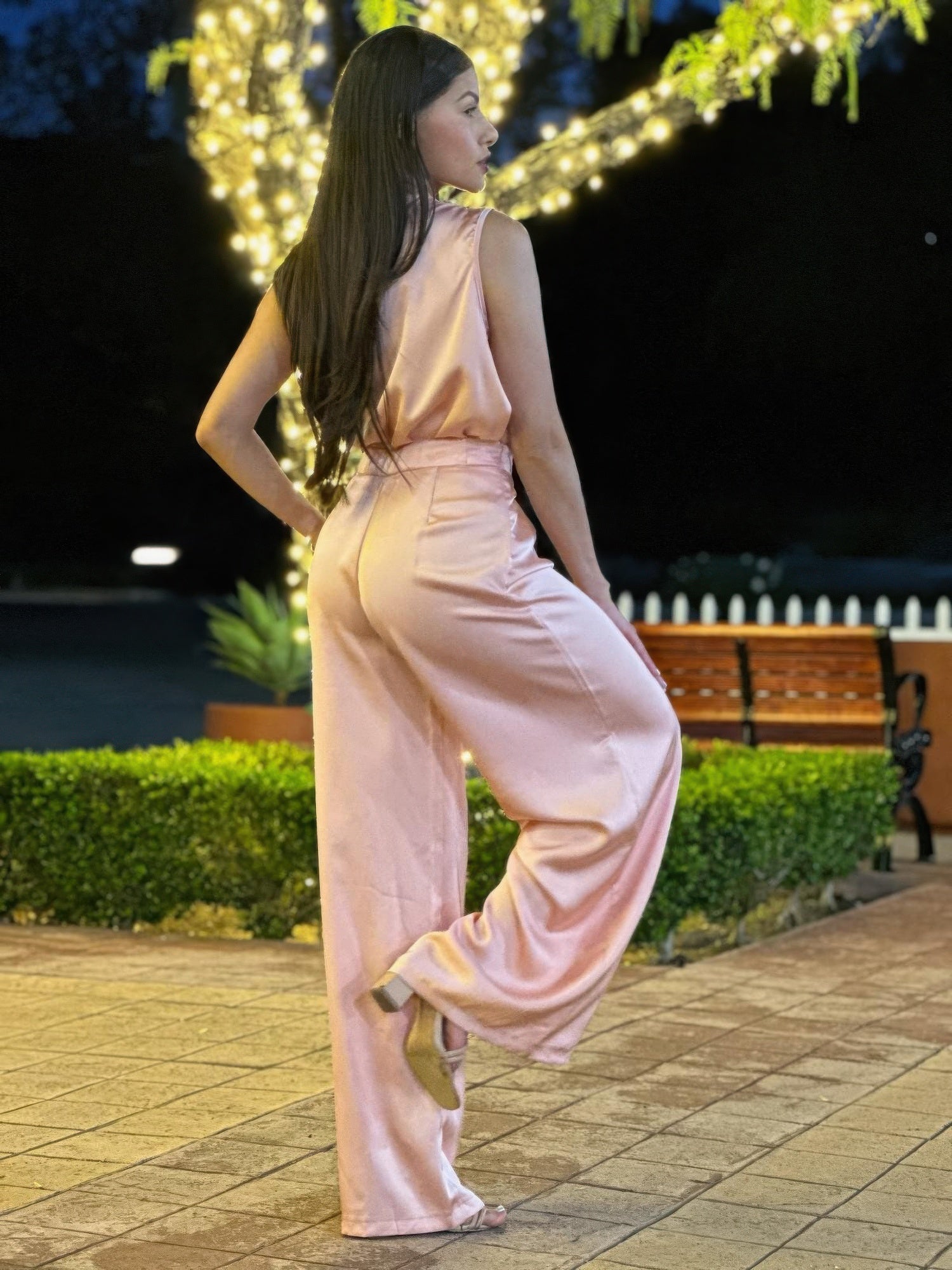 Light pink satin sleeveless top and wide-leg pants with belt-tie waistband, side view