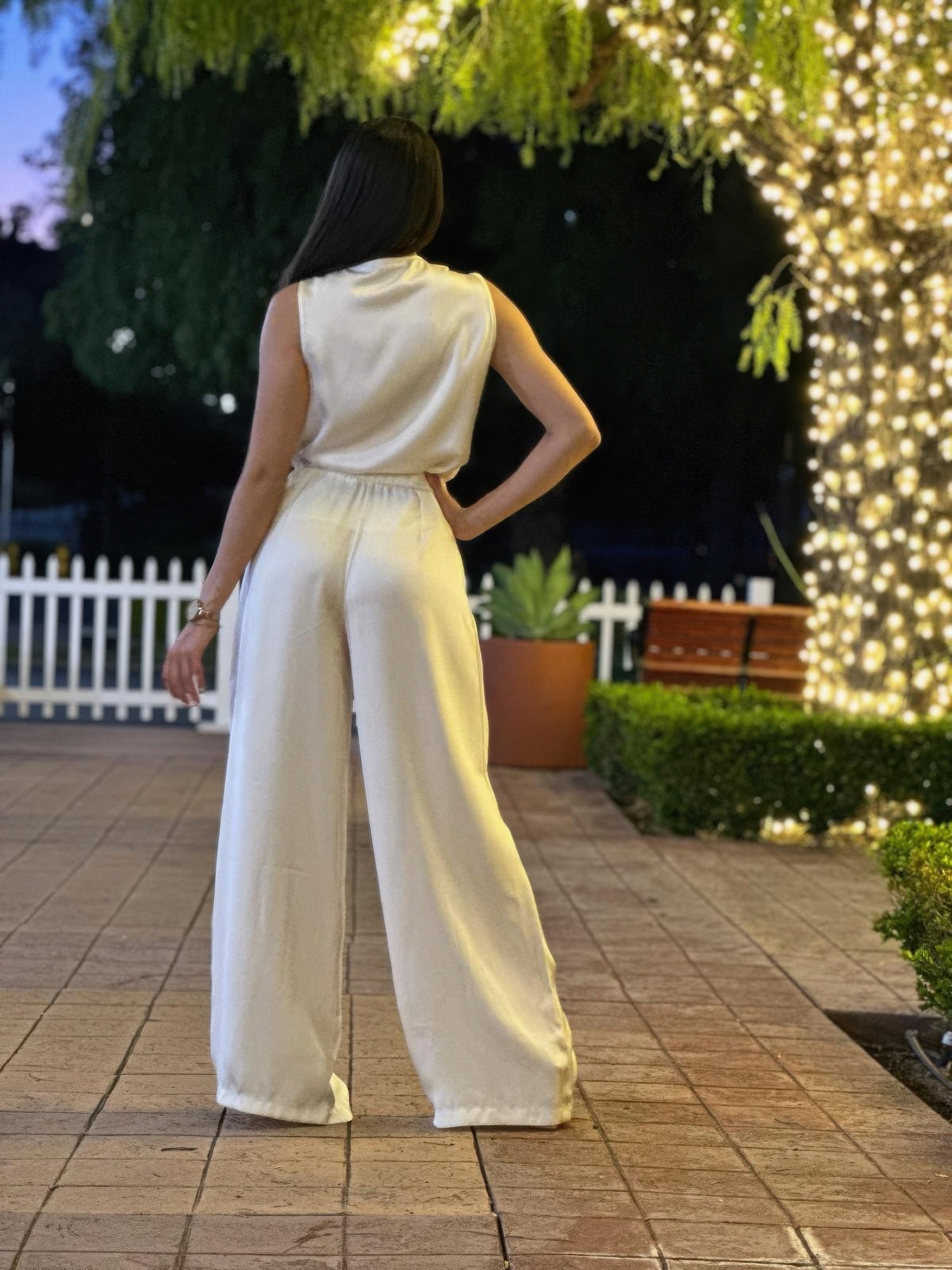 Satin light cream sleeveless top and wide-leg pants, rear view