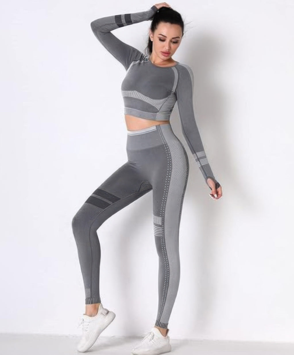 Seamless long sleeve set, grey crop top and leggings with ribbed stripe and dotted panel accents.