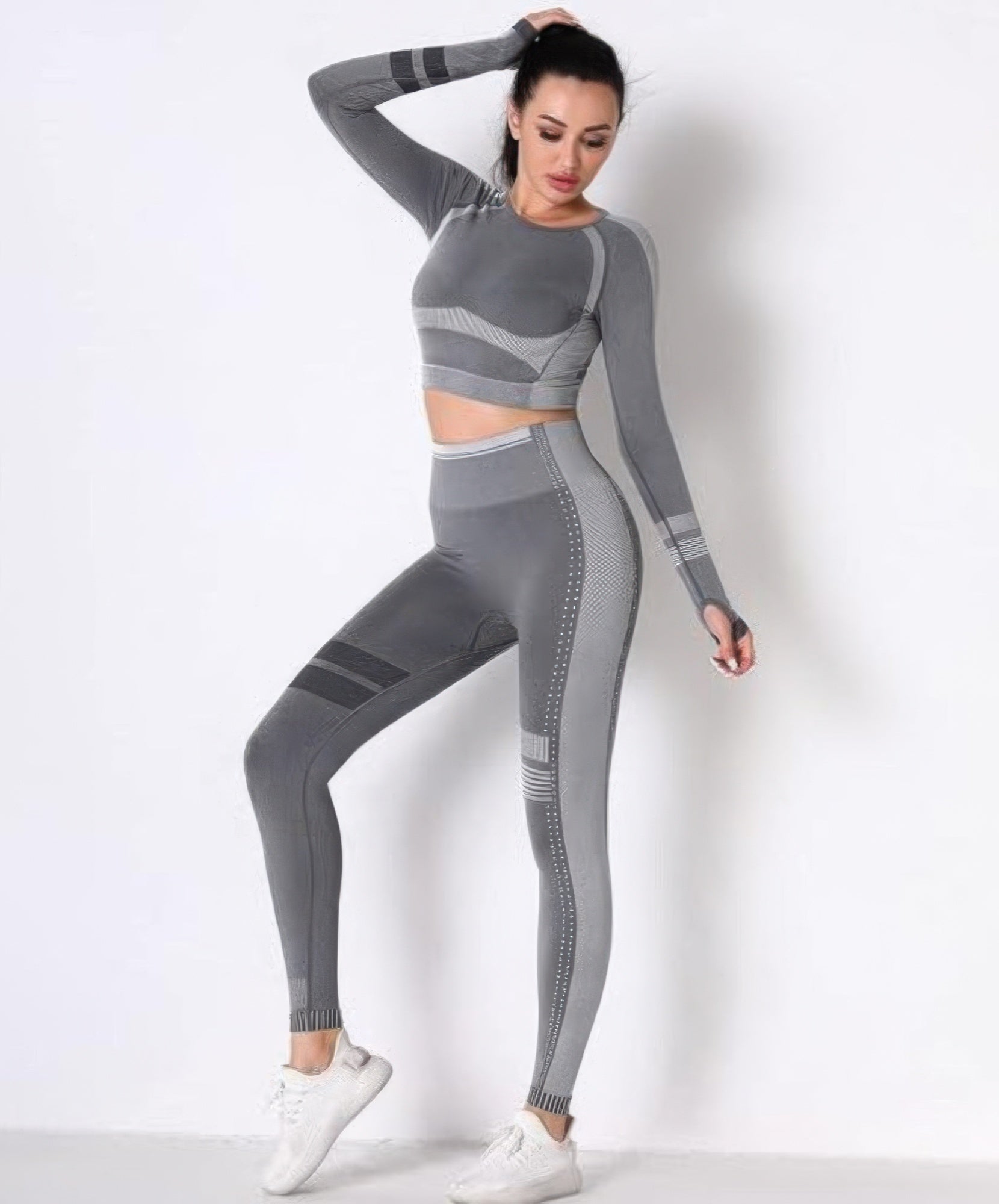 Seamless long sleeve set, grey crop top and leggings with ribbed stripe and dotted panel accents.
