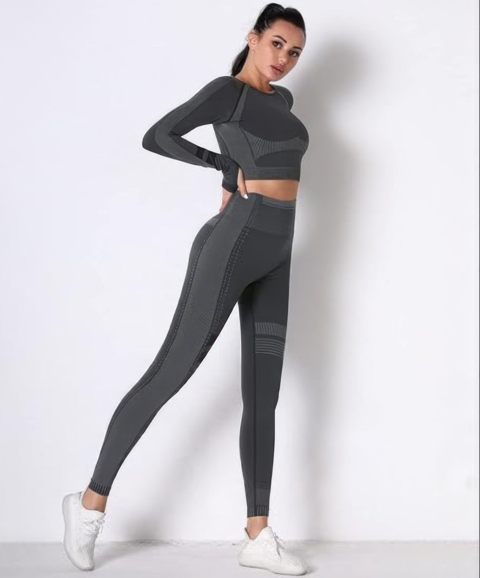 Dark gray seamless long-sleeve cropped top and leggings set with contrast seam panels