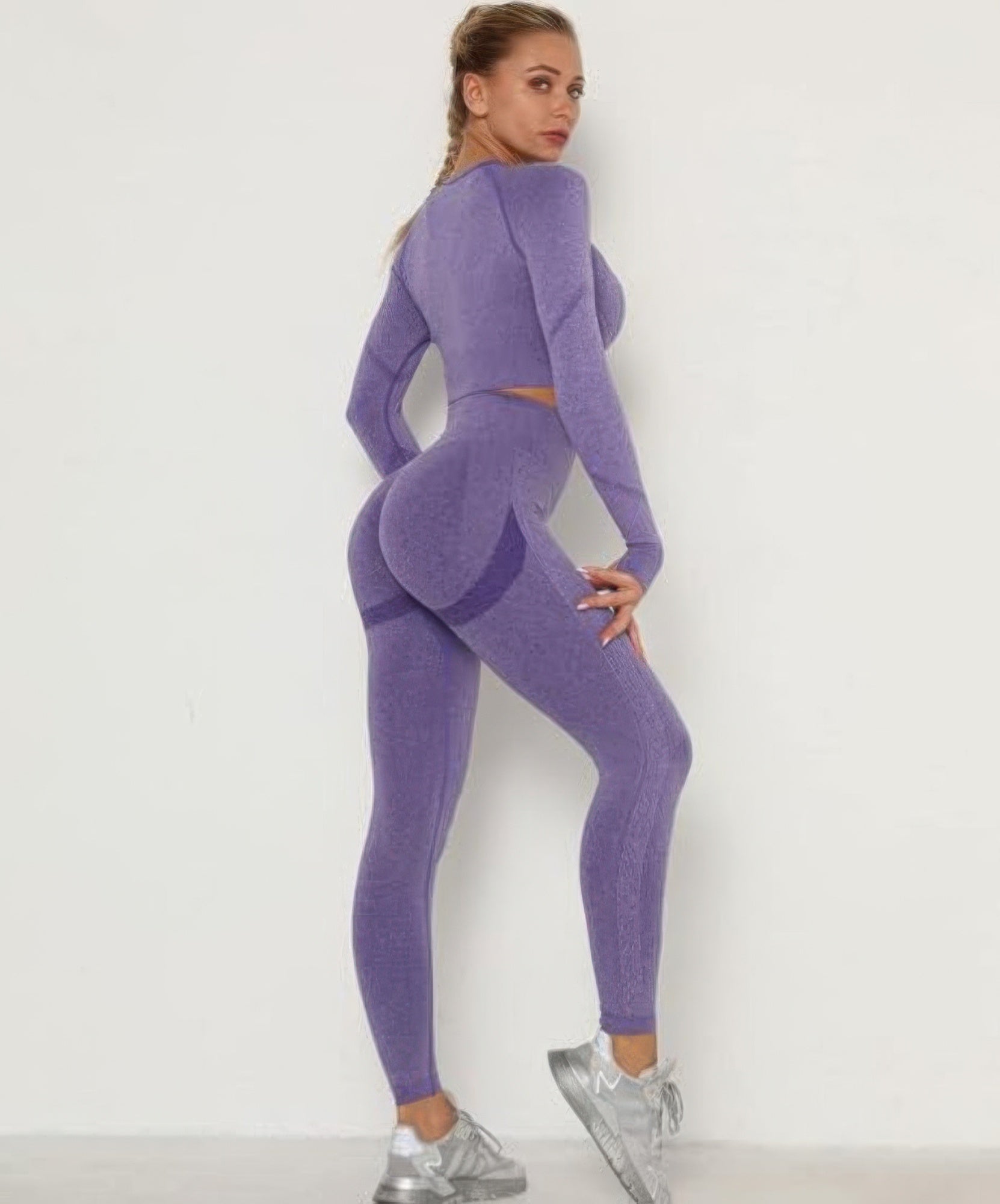 Back view: seamless purple leggings set with long-sleeve cropped top