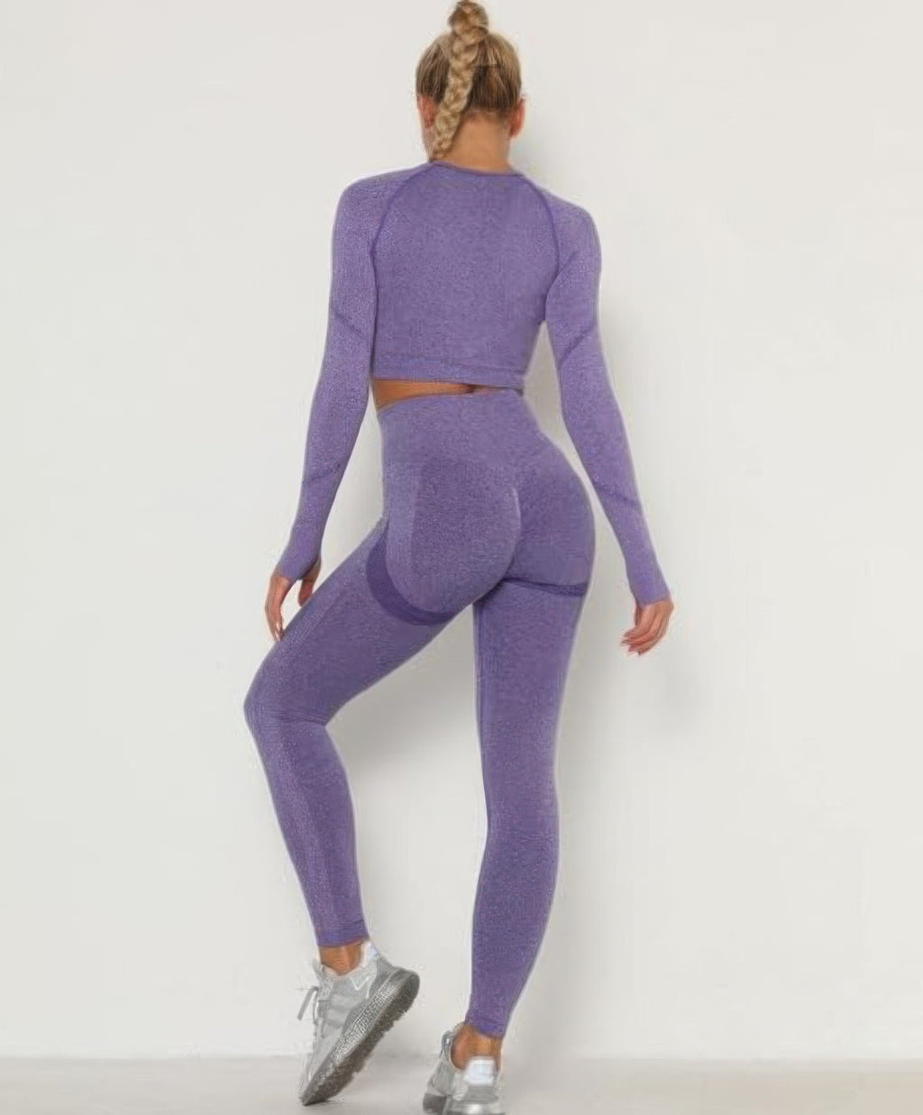 Seamless purple leggings and long-sleeve cropped top, snug rear fit