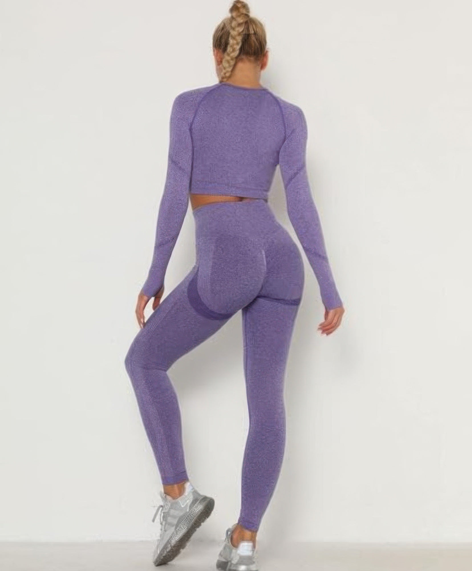 Seamless purple leggings and long-sleeve cropped top, snug rear fit