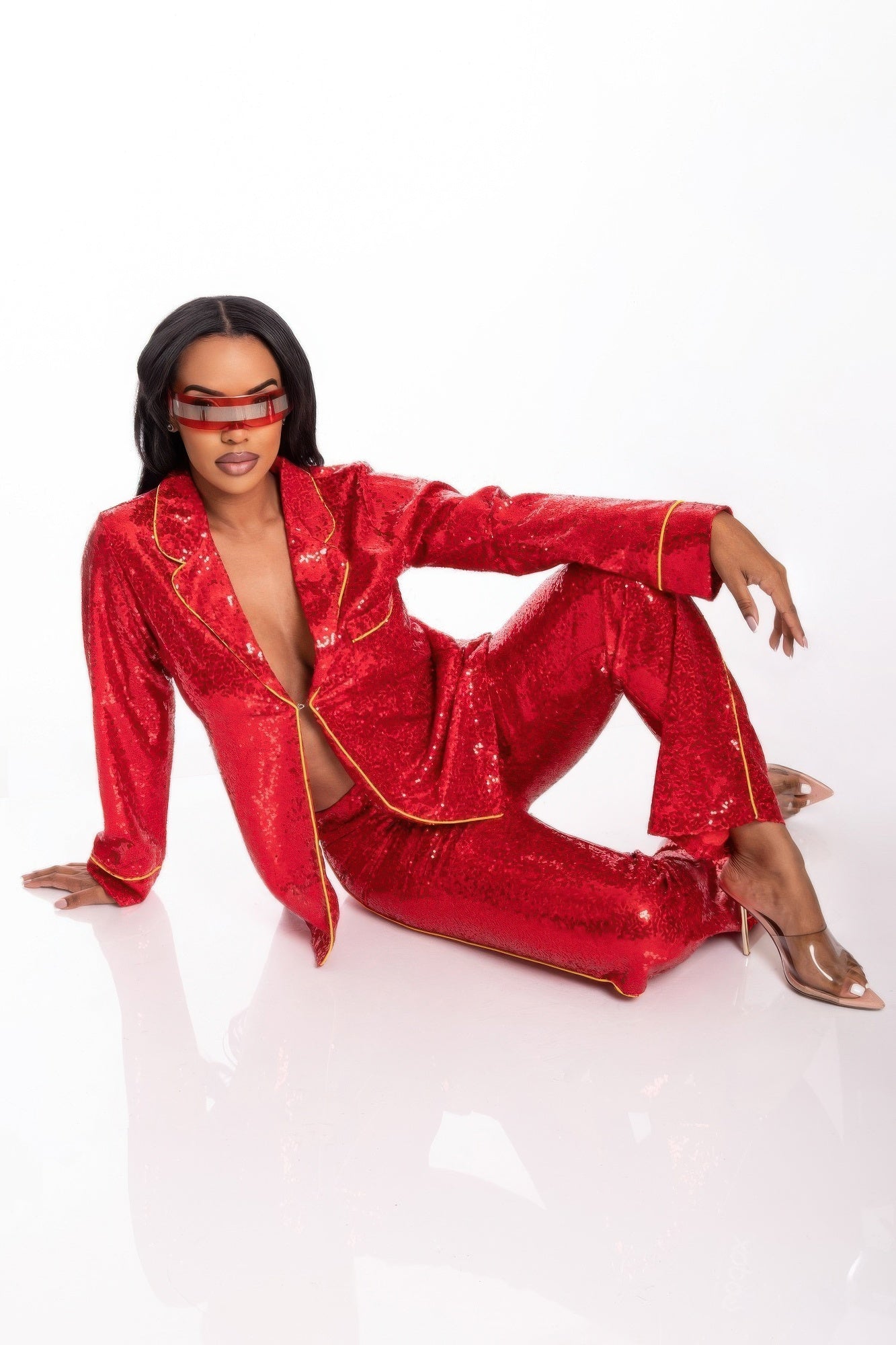 Sequin two-piece set in red: blazer with deep V neckline and wide-leg trousers