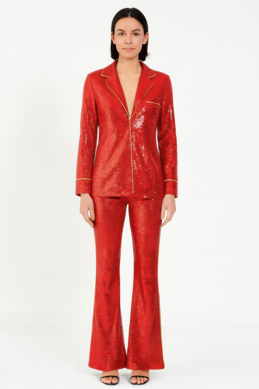 Red sequin blazer and pants set with collared lapels and gold piping accents