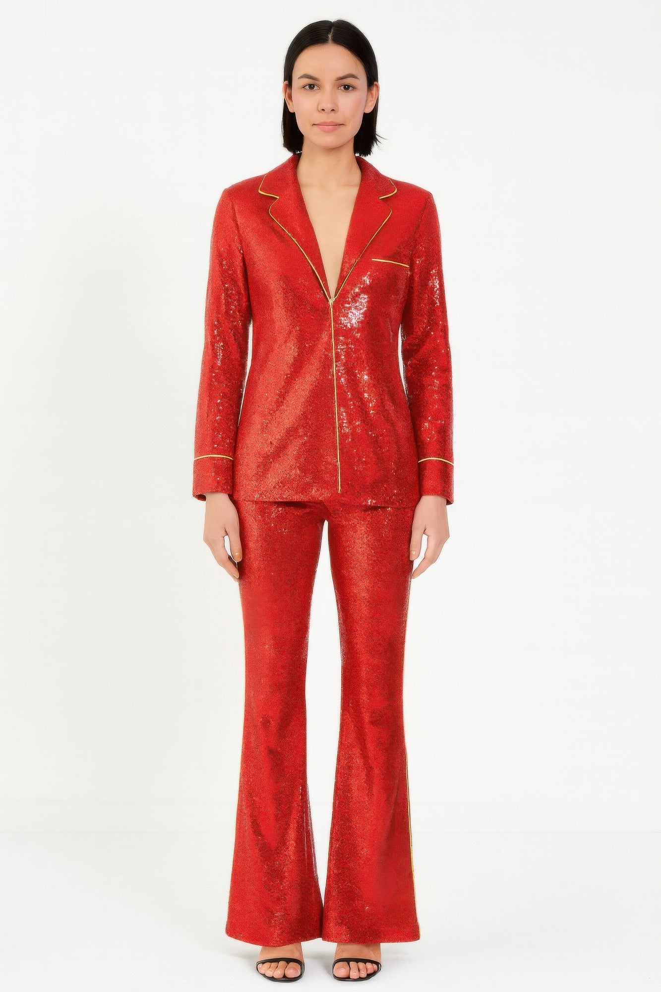 Red sequin blazer and pants set with collared lapels and gold piping accents