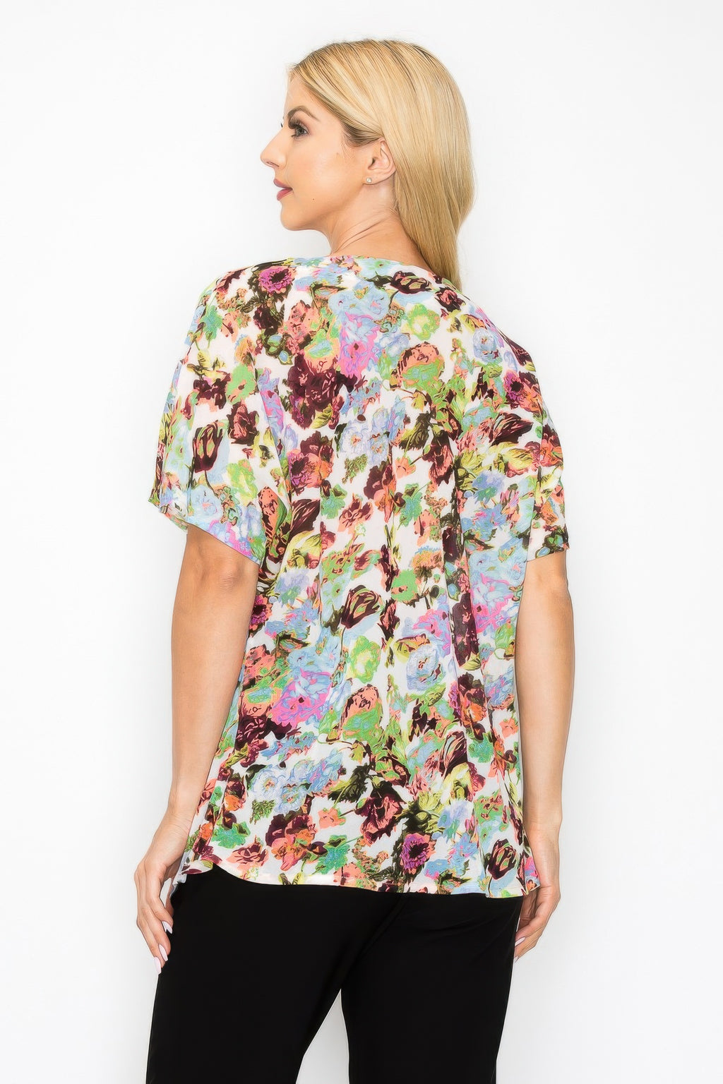 Neon floral short-sleeve top, back view with flowing relaxed fit