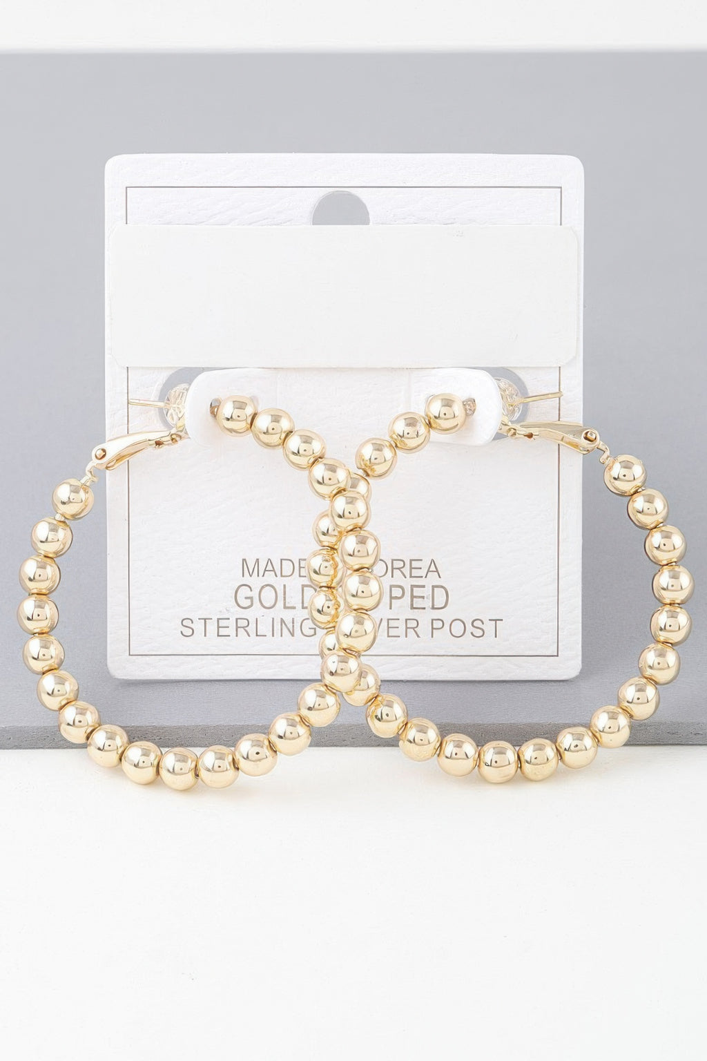Shiny beaded hoop earrings, gold-tone round beads and clasp backing