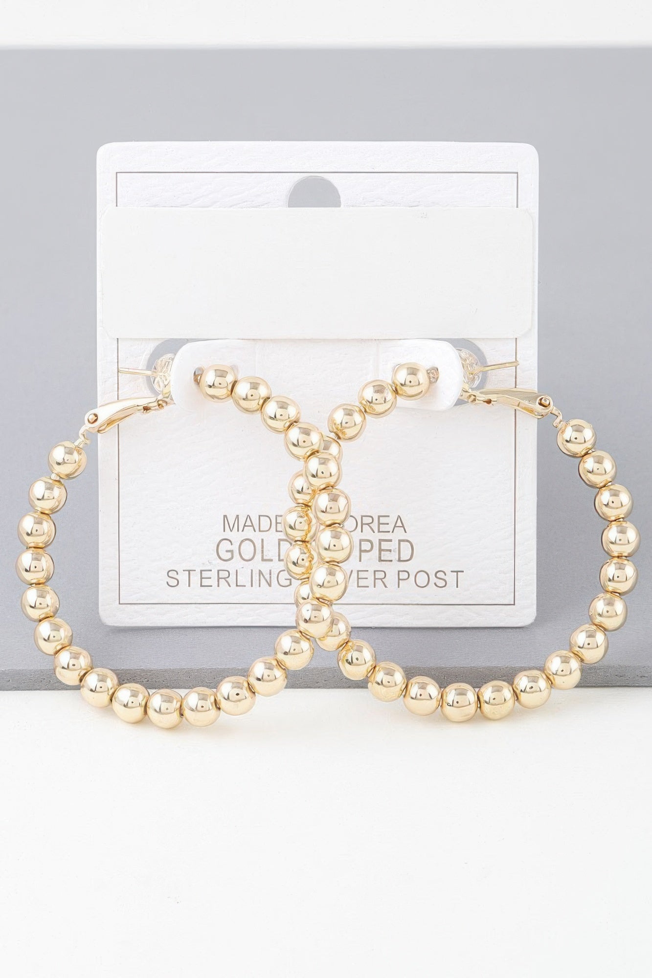 Shiny beaded hoop earrings, gold-tone round beads and clasp backing