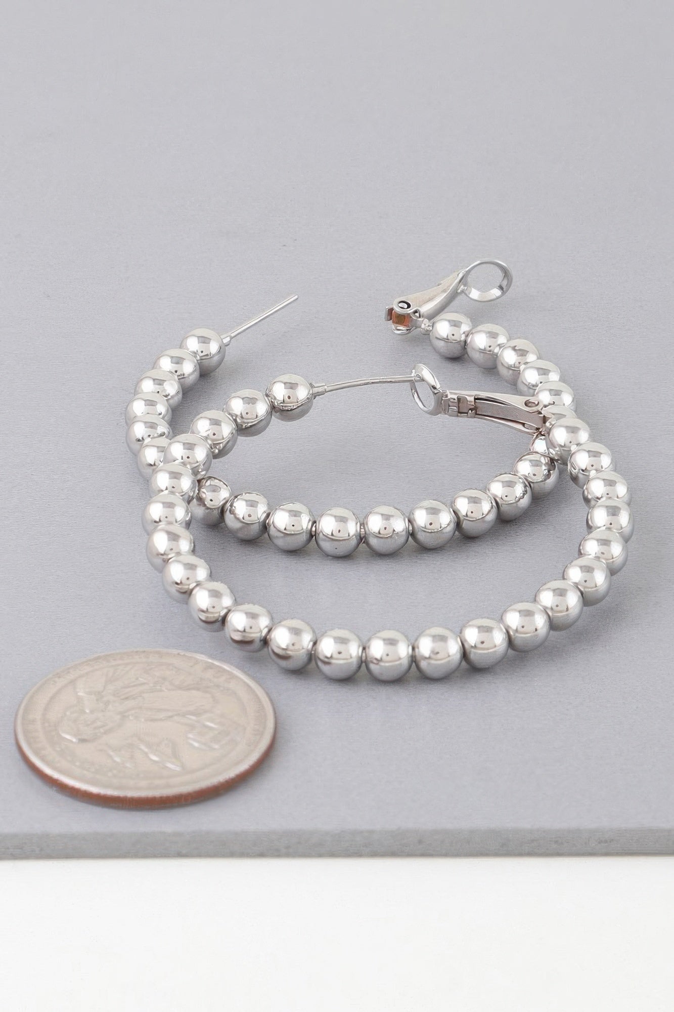 Shiny beaded hoop earrings, silver-tone round beads with hinged clasp