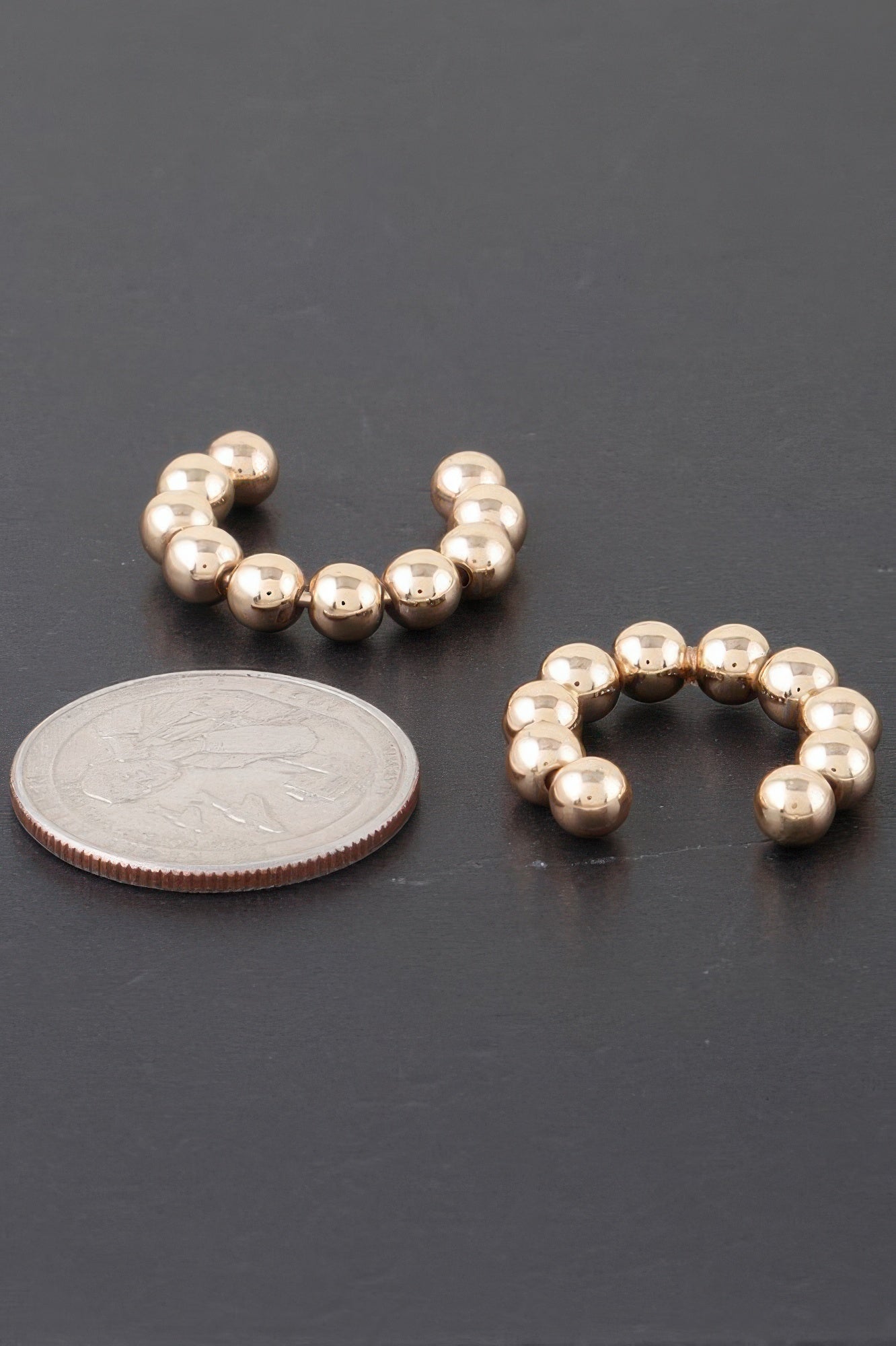 Shiny beaded hoop earrings in gold tone with round bead links
