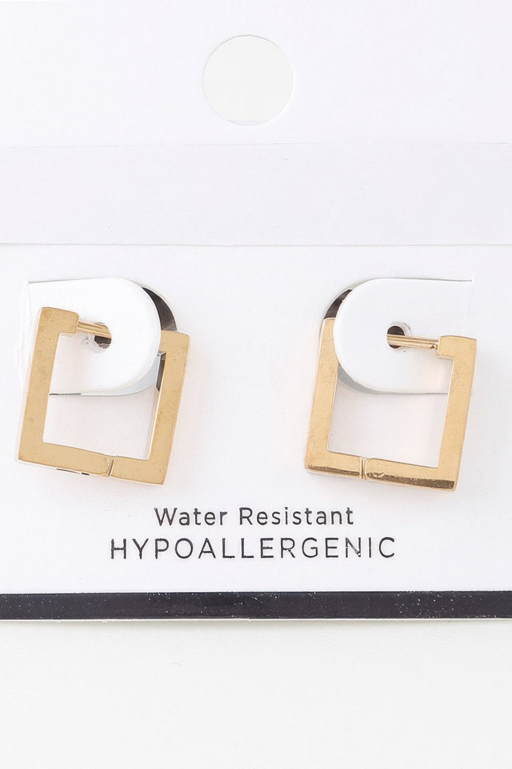 Gold cubic hoop earrings, square cutout, hinged clasp on white card