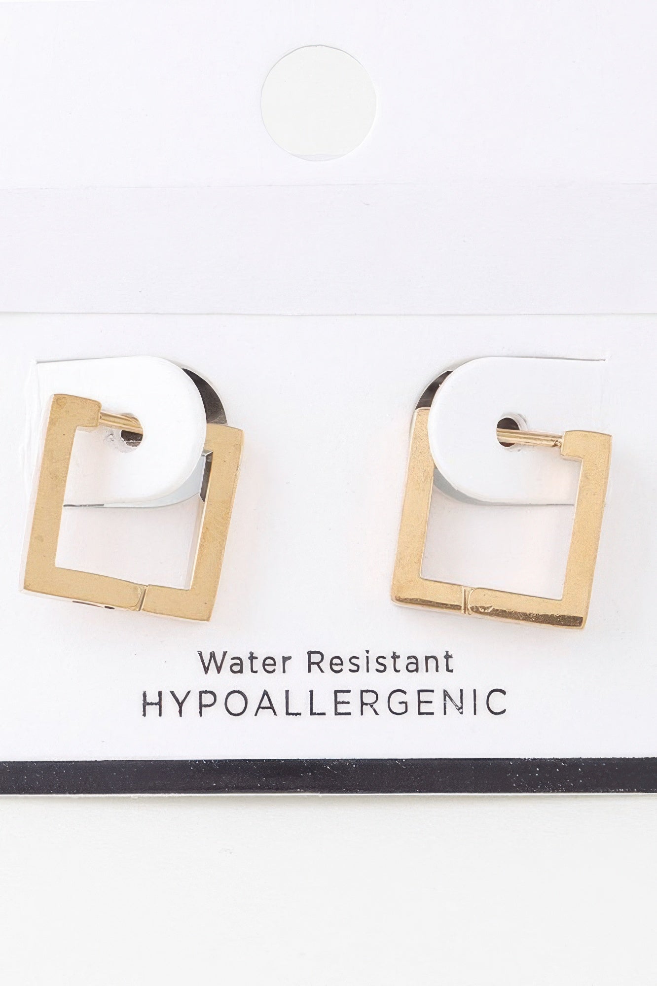 Gold cubic hoop earrings, square cutout, hinged clasp on white card