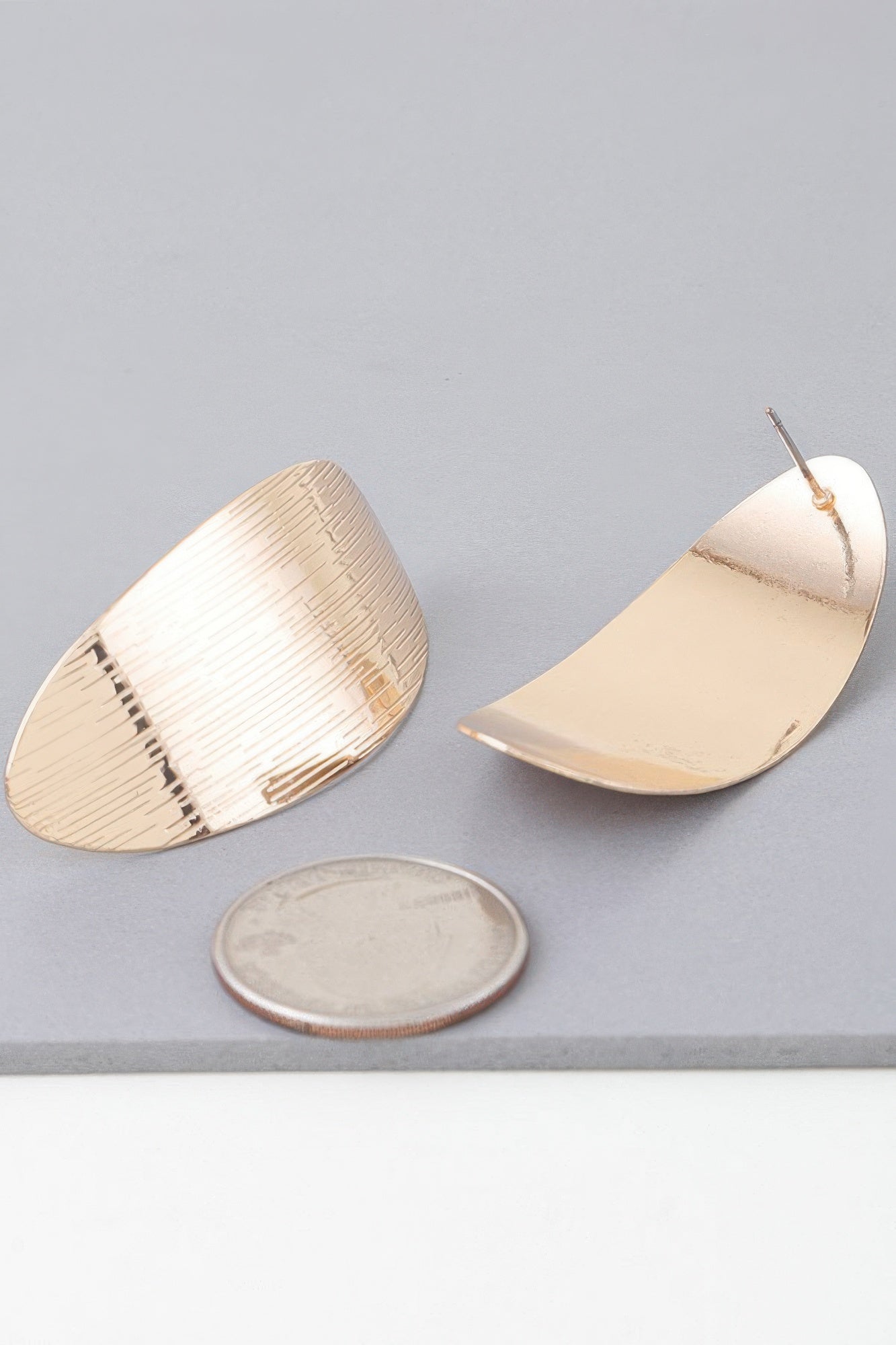 Gold curved peel earrings, textured half-moon backs with stud post