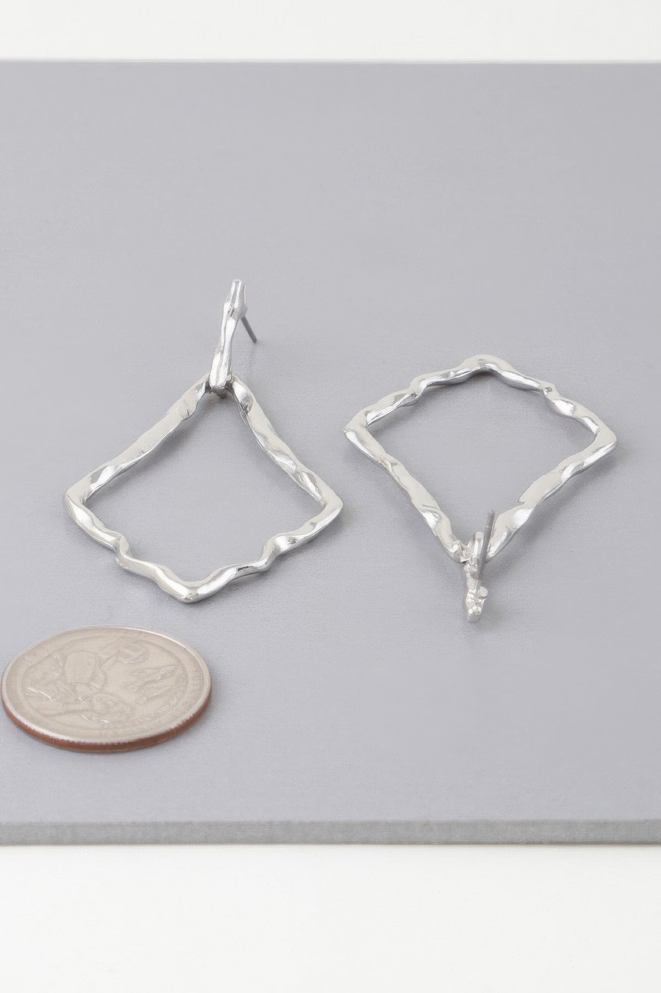 Silver hammered kite earrings, open diamond drop shapes with hook backs