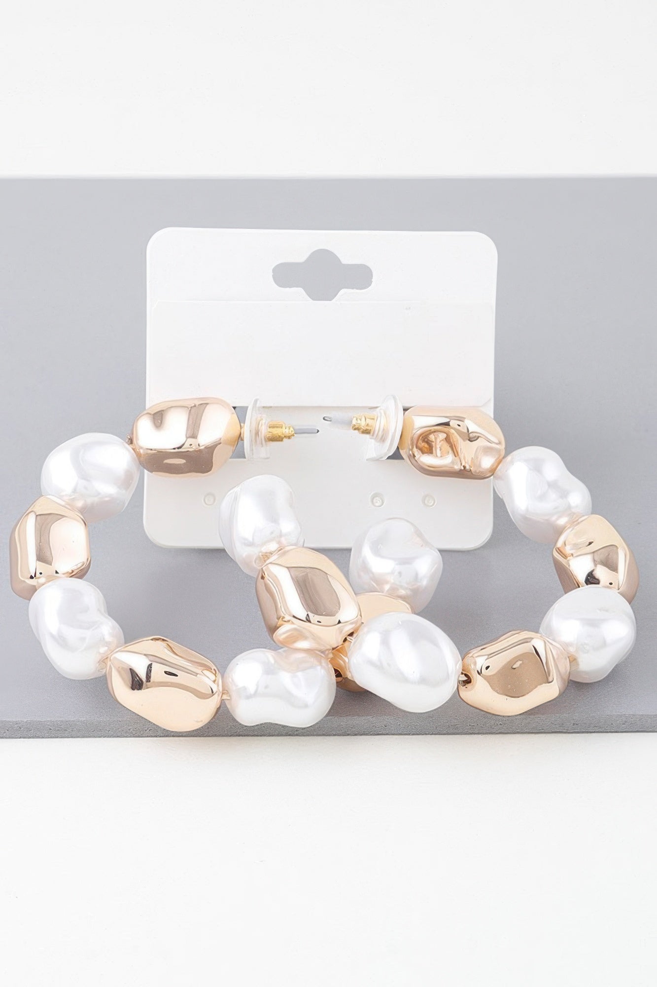 Shiny N Pearl hoop earrings with white faux pearls and gold-tone links