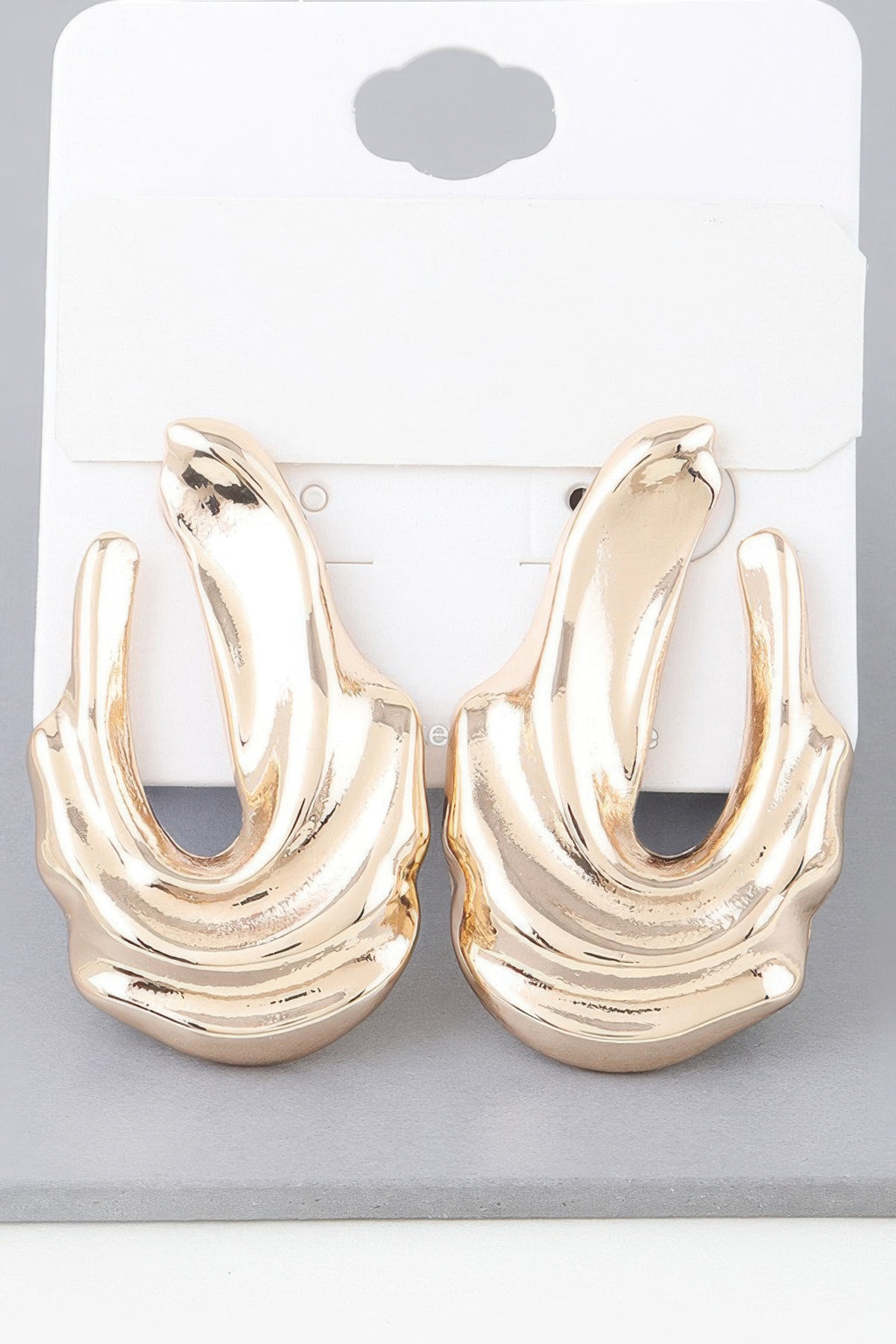 Shiny gold ripple drop earrings, sculpted curved hoops with textured finish