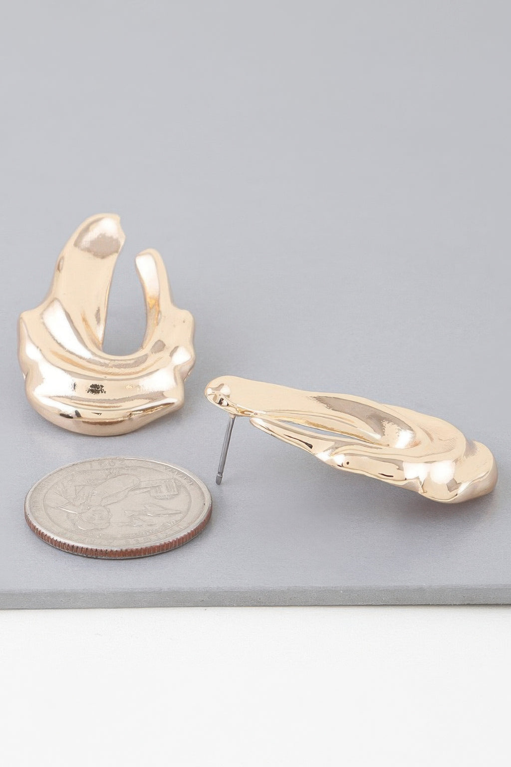 Shiny gold ripple drop earrings, long drop hoops with textured metallic sheen