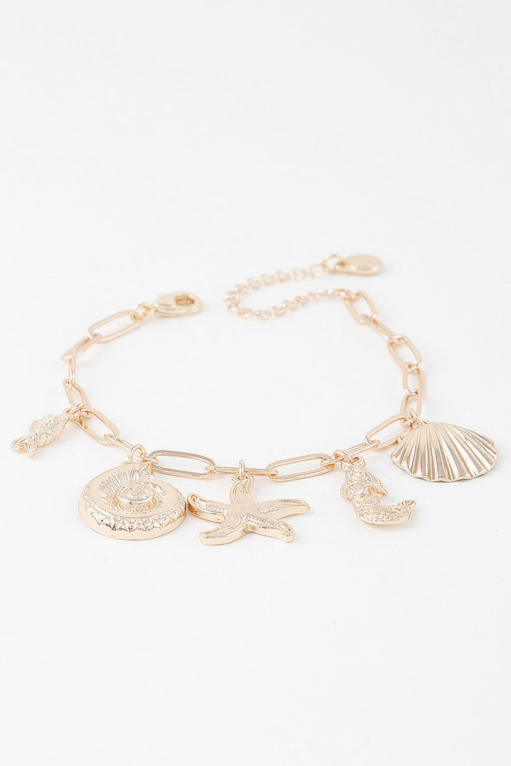 Gold sea creatures bracelet, round engraved seashell charm plus starfish and fish charms