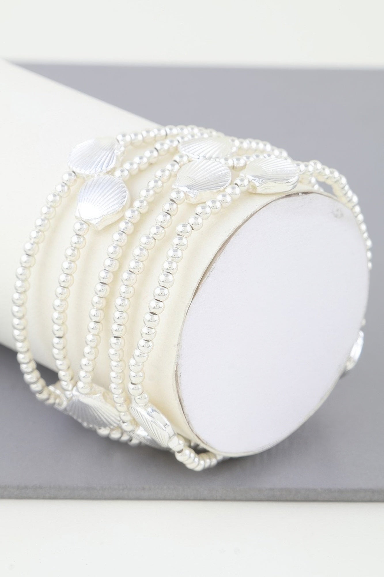 Shiny seashell beaded bracelet in silver tone with shell charms and pearl-like beads