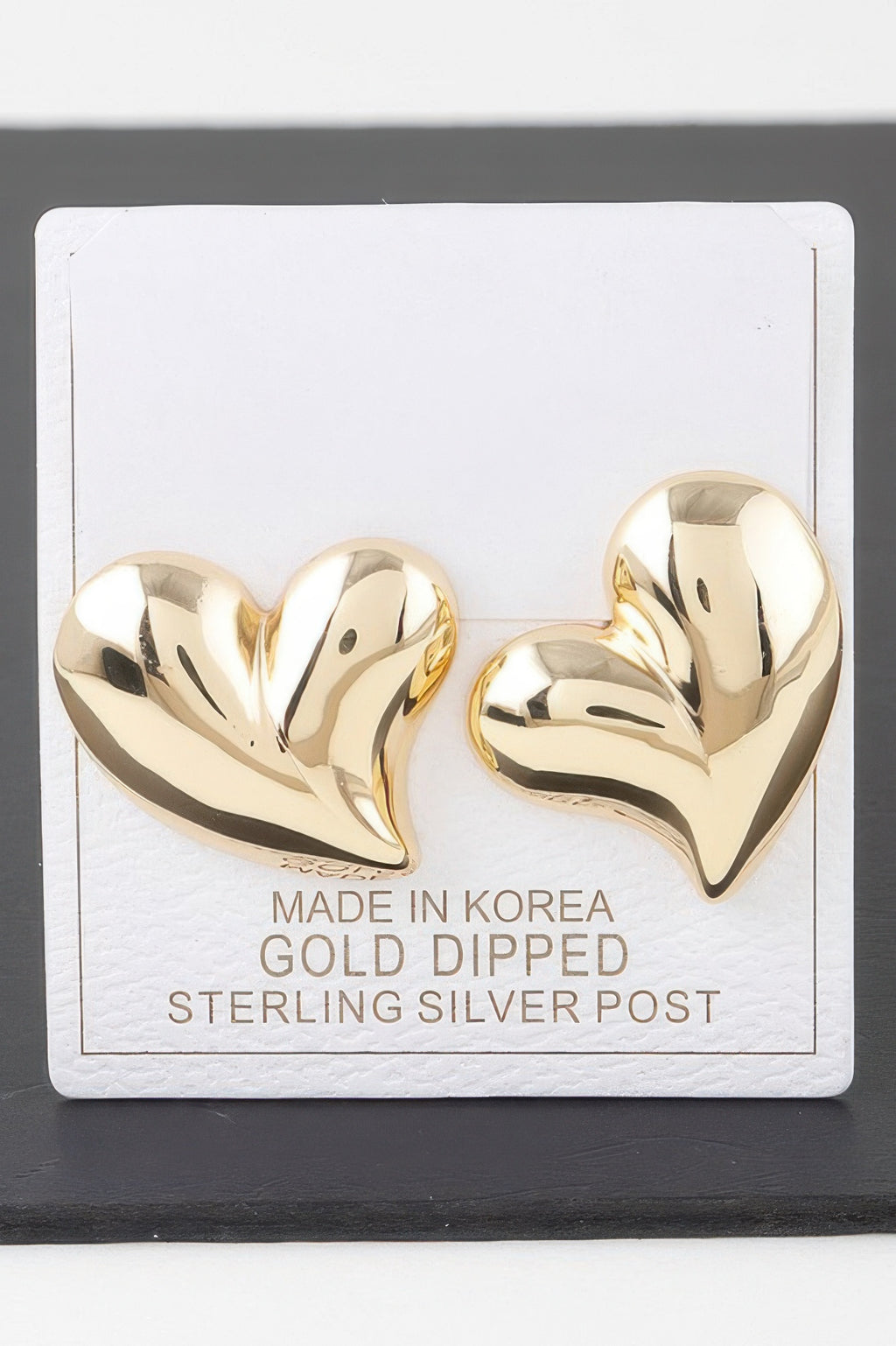 Shiny Twin Hearts Earrings, gold heart studs with post backs on card