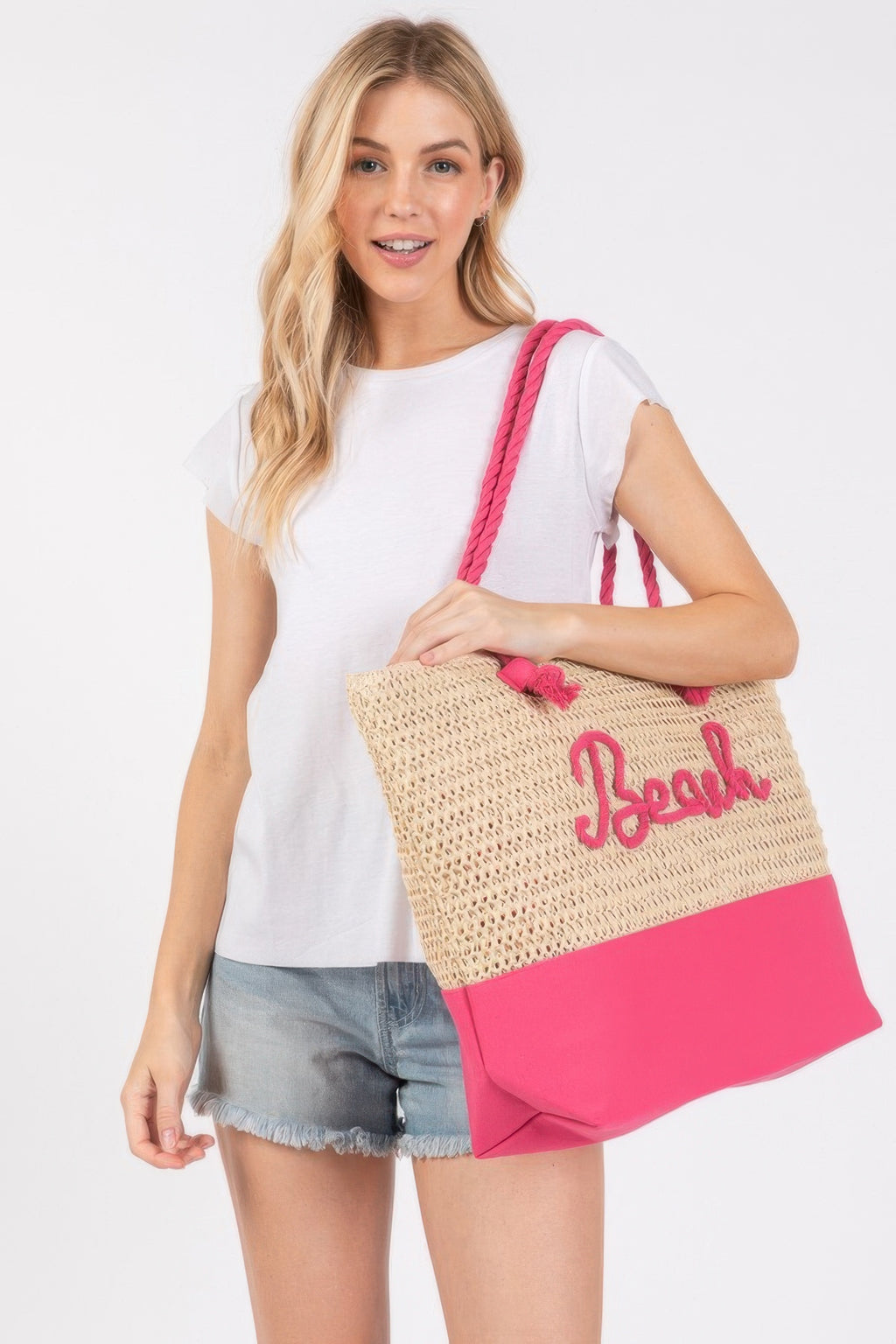 Crochet beach tote with rope handles, 'Beach' logo, pink straps and base